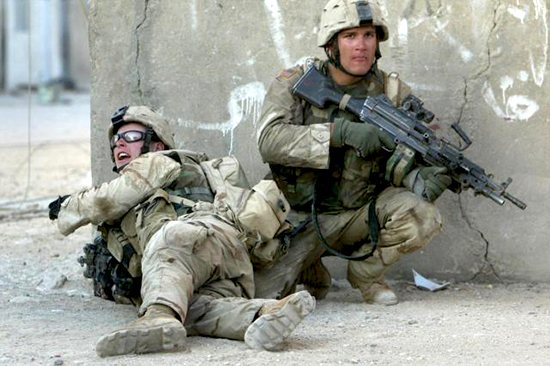 Sgt. Matthew Zedwick (left) and a fellow Soldier fight in the streets of Najaf, Iraq, Aug. 16, 2004